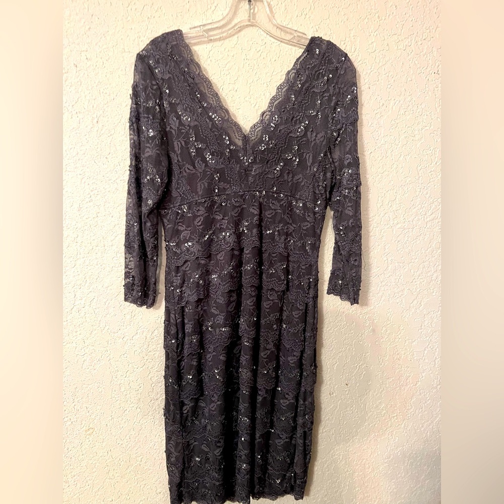 Sequined dress, knee length, V in the front and the back.
